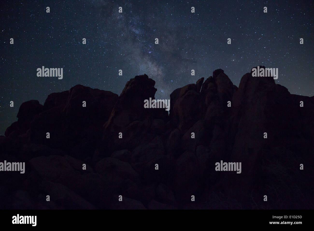 Rock formation under Milky Way, Joshua Tree National Park Stock Photo