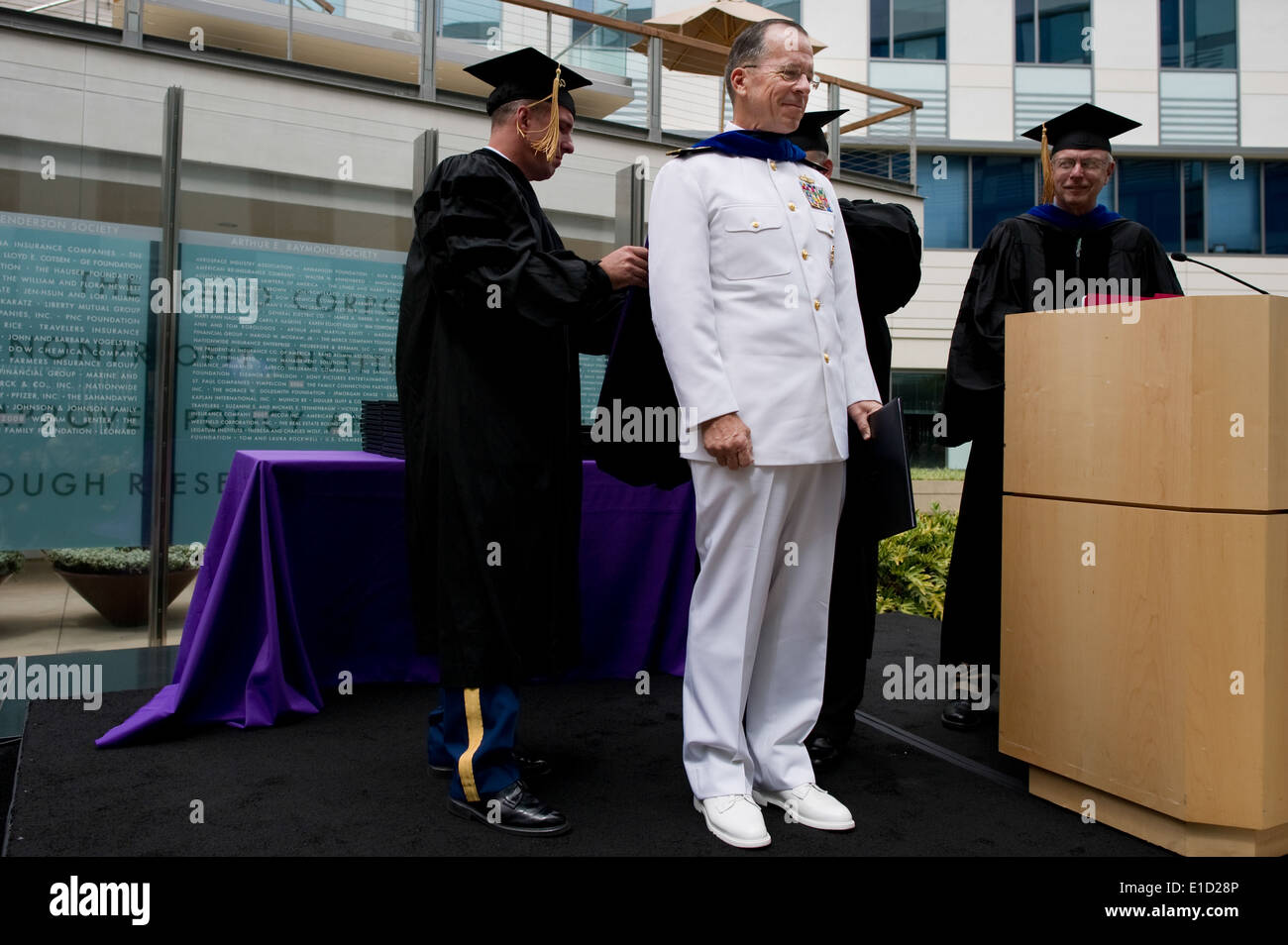 Chairman of the Joint Chiefs of Staff Navy Adm. Mike Mullen is presented with an honorary degree before speaking at the Frederi Stock Photo