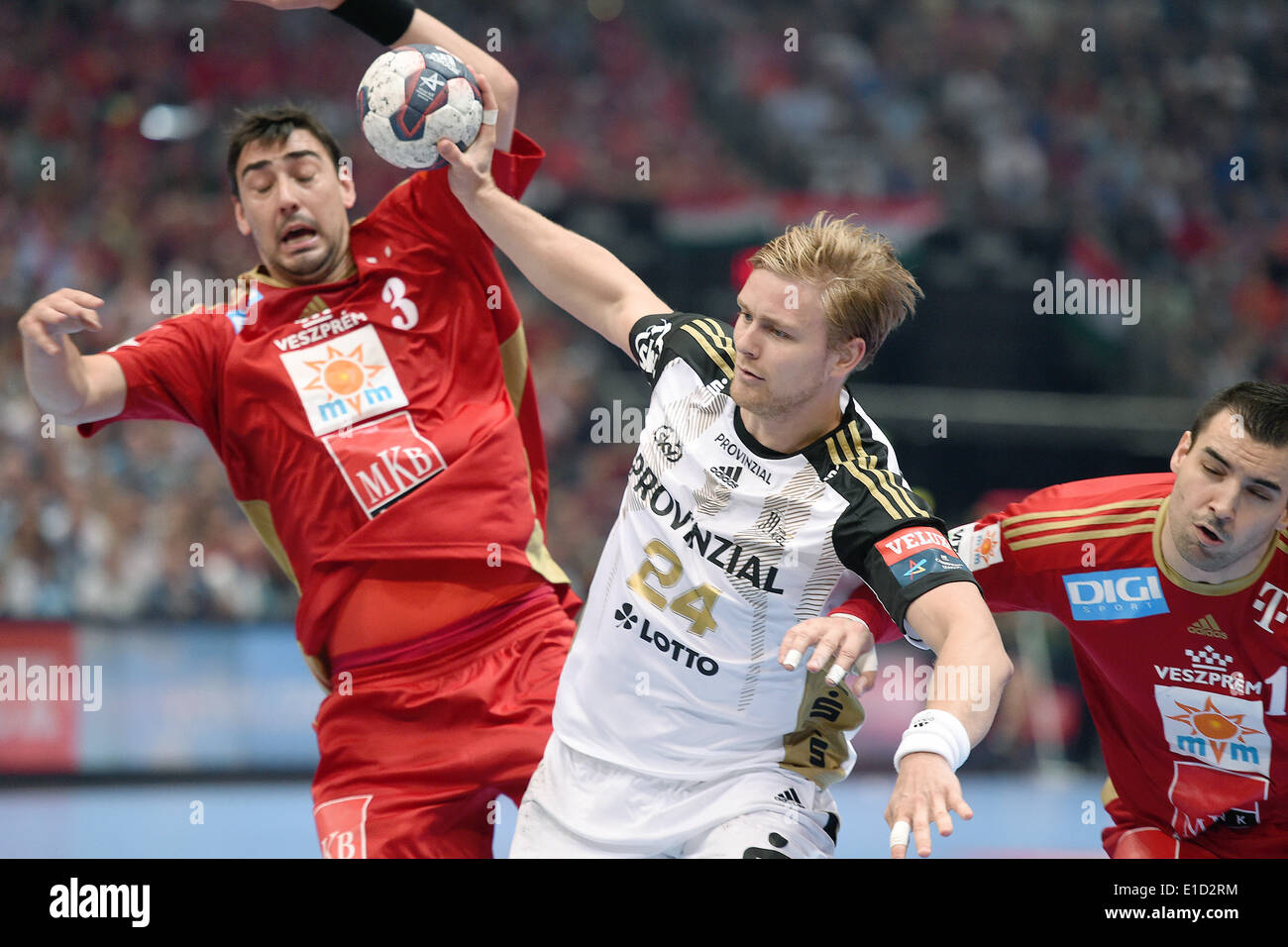 Cologne, Germany. 31st May, 2014. Kiel's Aron Palmarsson (M) in action against Veszprem's Peter Gulyas (L) and Carlos Ruesga Pasarin during the Handball Champions League EHF Final Four match between MKB Veszprem and THW Kiel at the Lanxess-Arena in Cologne, Germany, 31 May 2014. Photo: MARIUS BECKER/dpa/Alamy Live News Stock Photo