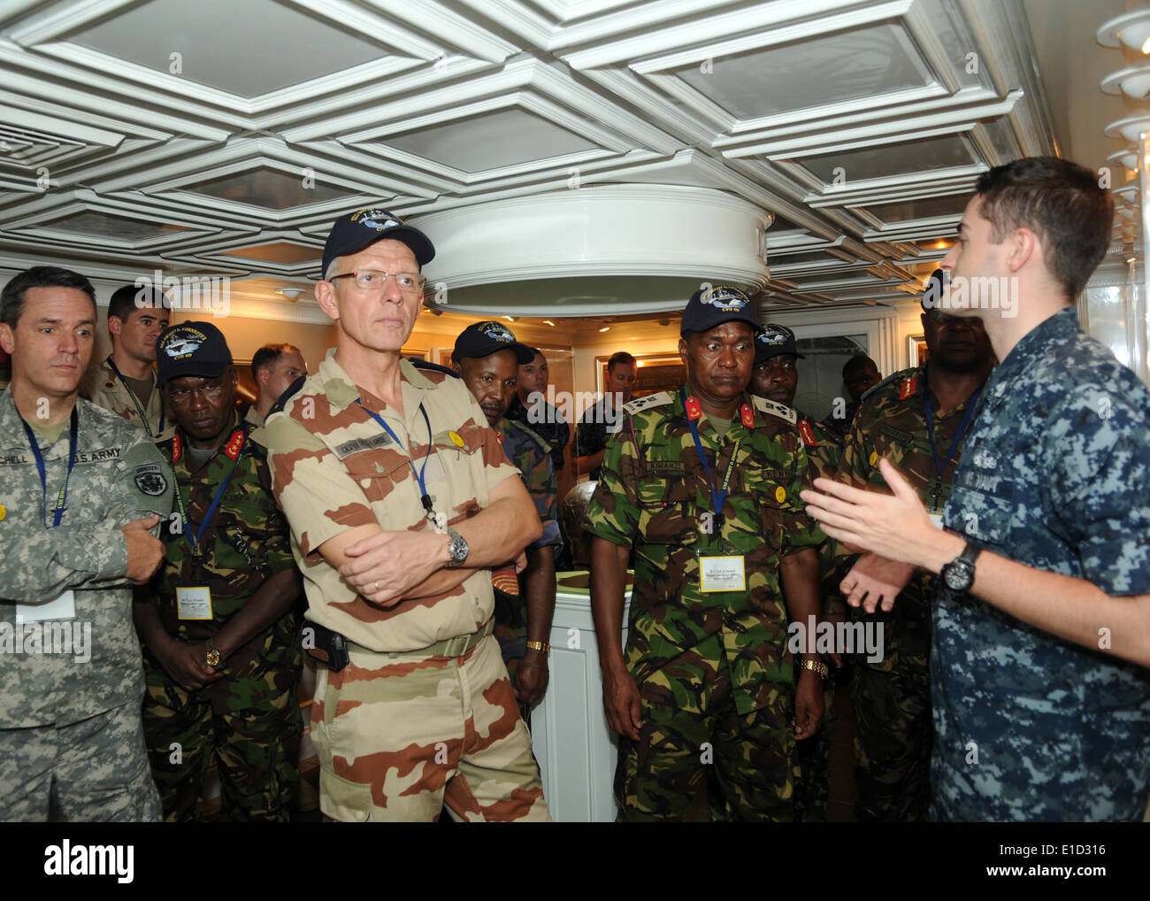U.S. Navy Mass Communication Specialist 2nd Class John Herman briefs visitors from East Africa and coalition partner countries Stock Photo