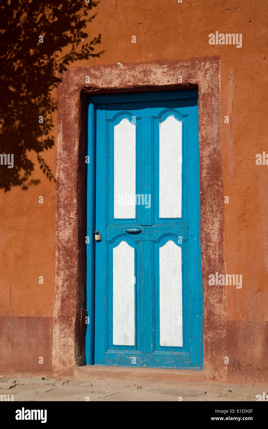 Blue and white painted door in Bolivia Stock Photo