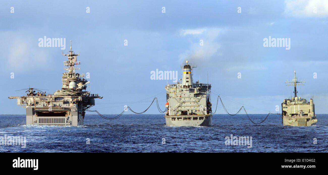 The amphibious assault ship USS Bonhomme Richard (LHD 6), left, and the Royal Australian Navy amphibious ship HMAS Kanimbla (L Stock Photo