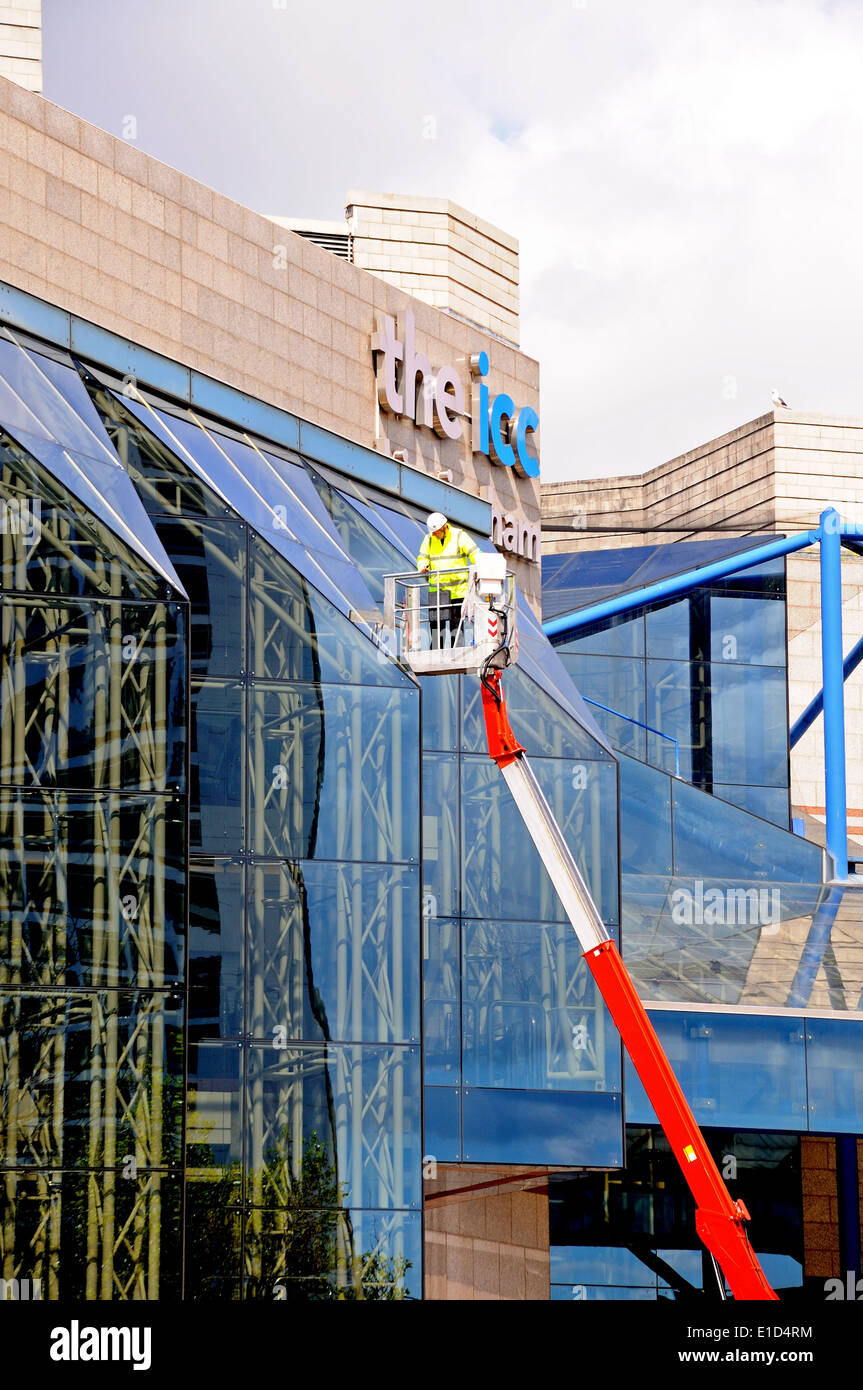 Window cleaner cleaning the windows of the International Convention