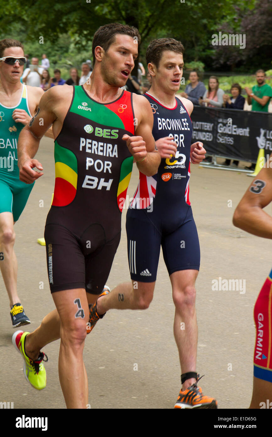 Joao Pereira (Portugal) who finished in third place leads Jonathan Brownlee (Great Britain) fifth on the last lap of the ITU World Triathlon Series, London UK, 31st May 2014. Stock Photo