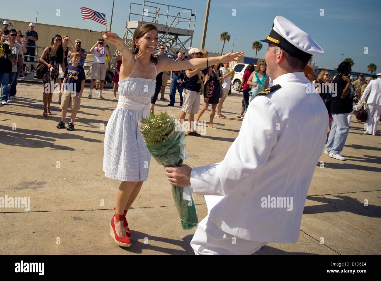 U.S. Navy Lt. j.g. Peter Goodman greets his wife during a homecoming ceremony for the guided-missile frigate USS Klakring (FFG Stock Photo