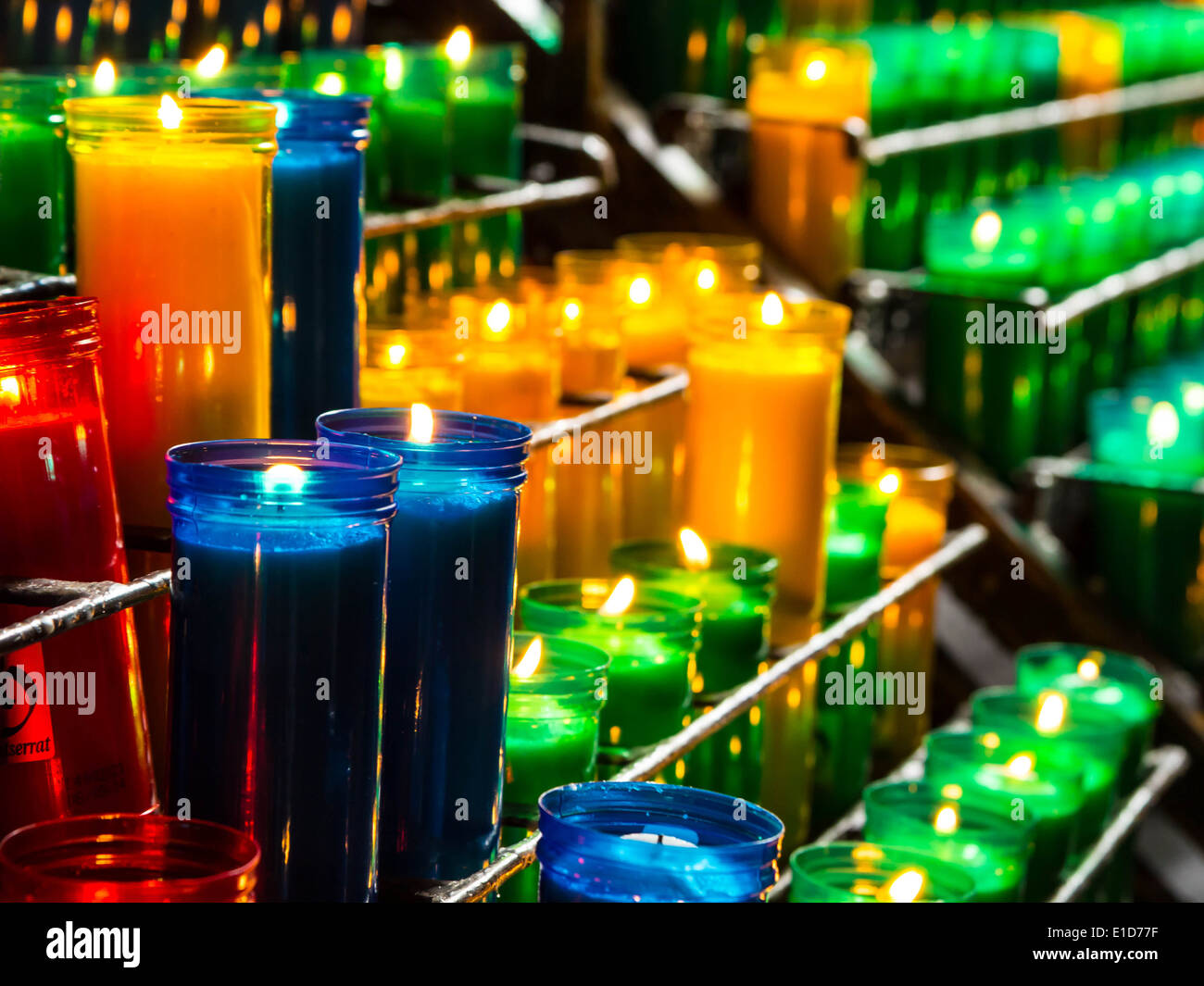 Burning catholic prayer candles in transparent chandeliers Stock Photo Alamy