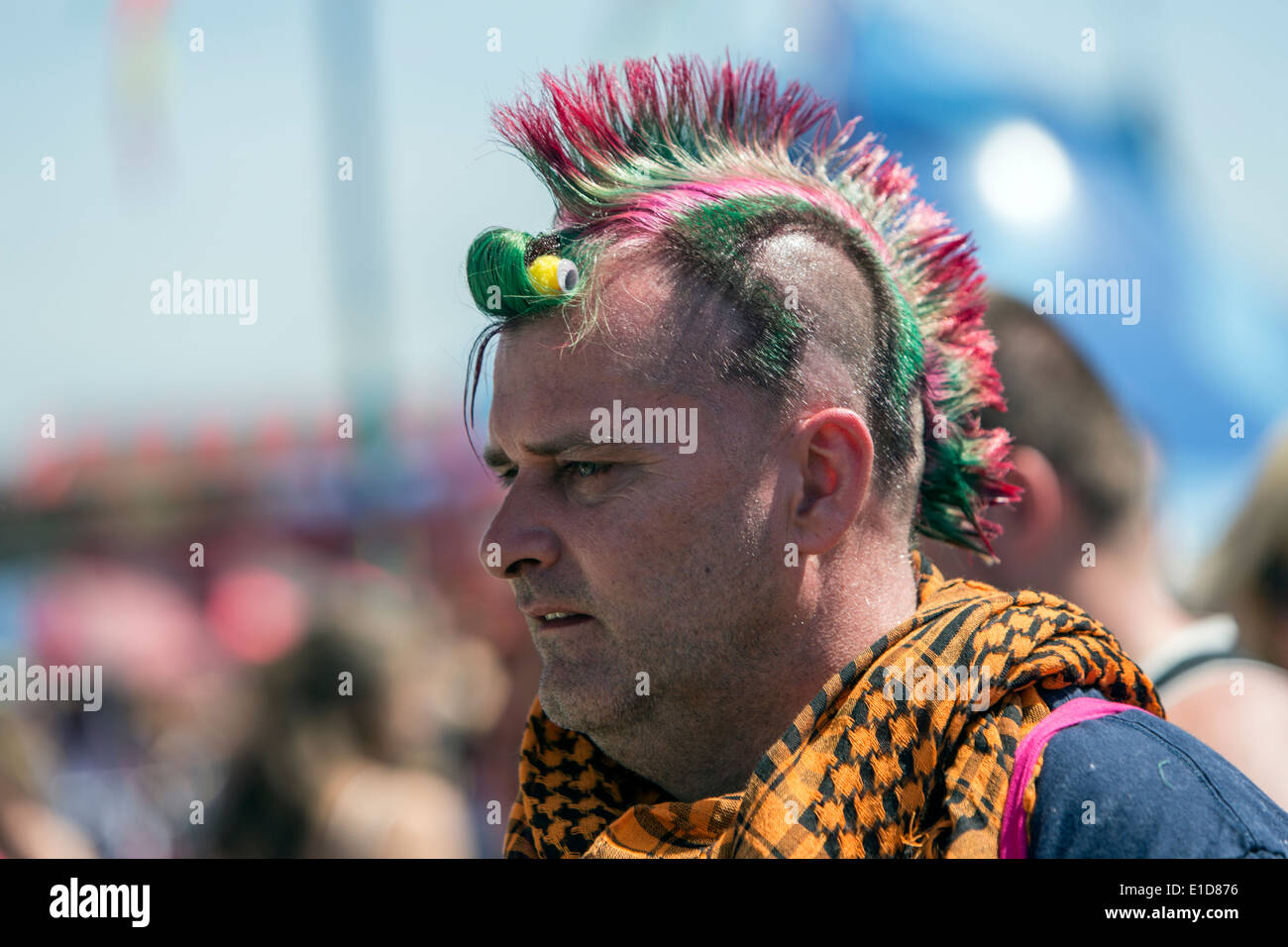 Man with colored hair in Glastonbury Festival 2013 Stock Photo