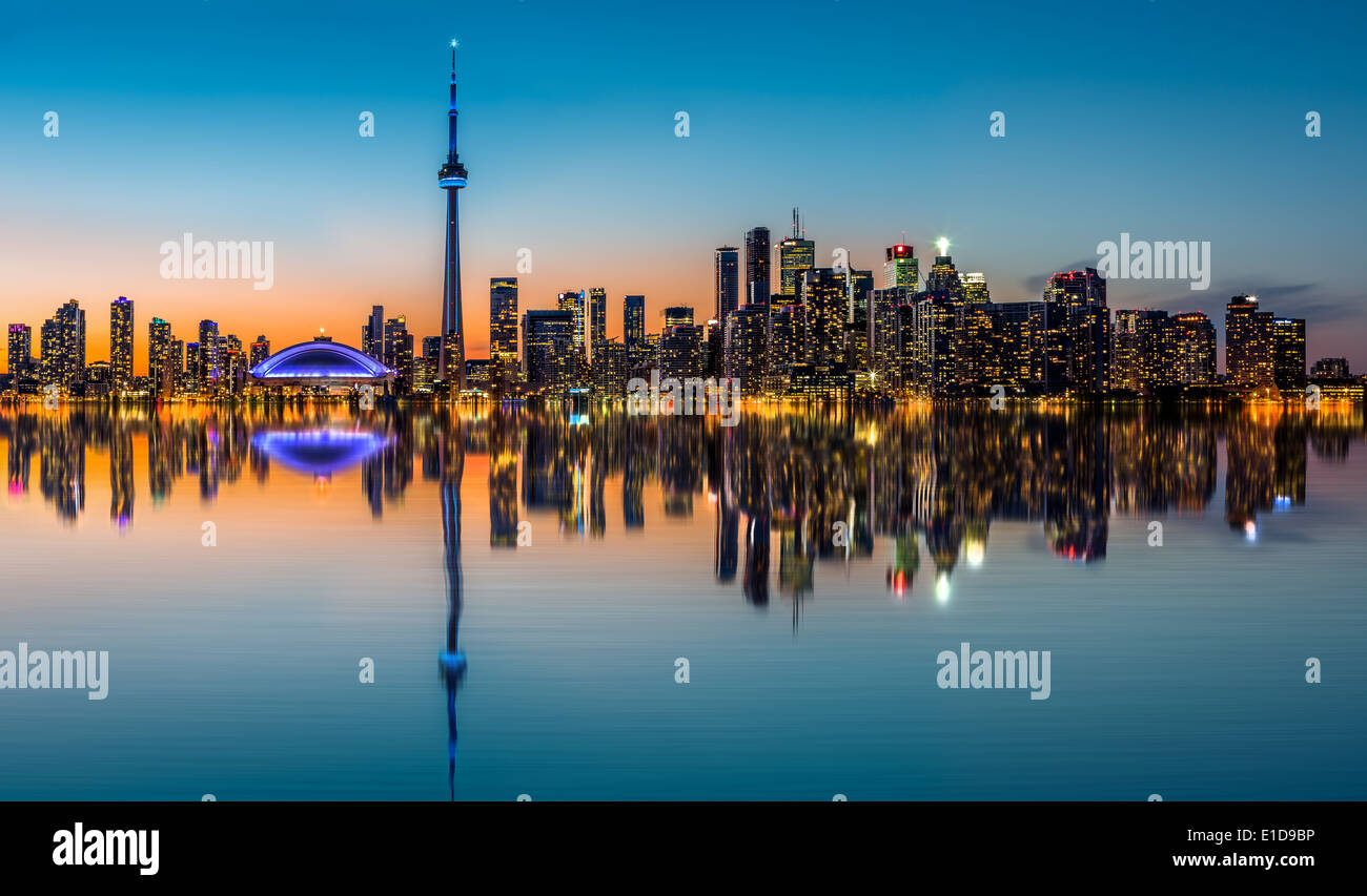 Toronto skyline at dusk, reflected in the Inner Harbor Bay Stock Photo