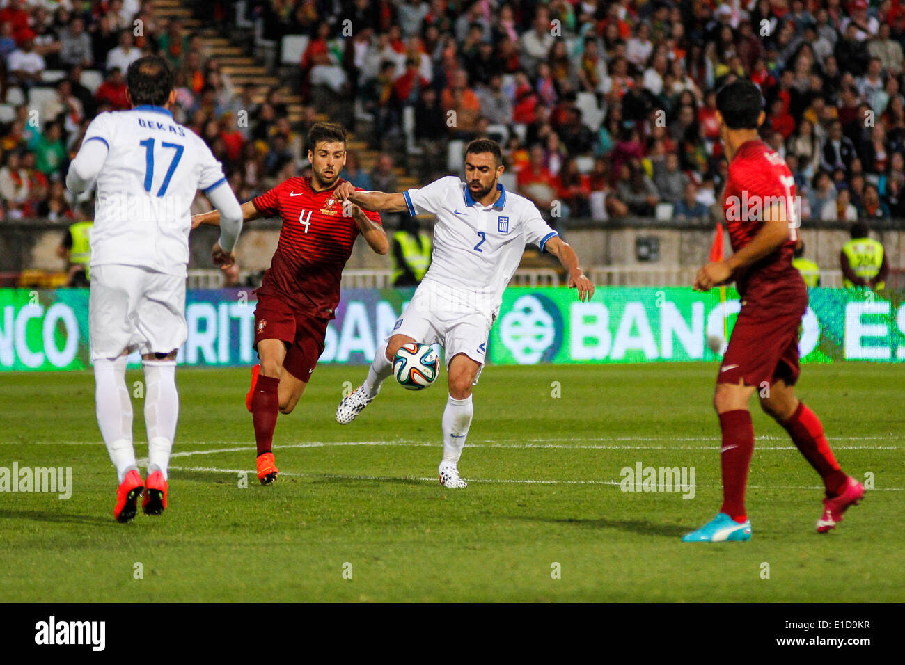 Lisbon, Porrtugal. 31st May, 2014. Portugal midfielder Miguel Veloso (4) and Greece defender Giannis Maniatis (2) vies for the ball during preparatory friendly match for the World Cup at the National Stadium in Lisbon, Portugal, Saturday, May 31, 2014. Credit:  Leonardo Mota/Alamy Live News Stock Photo