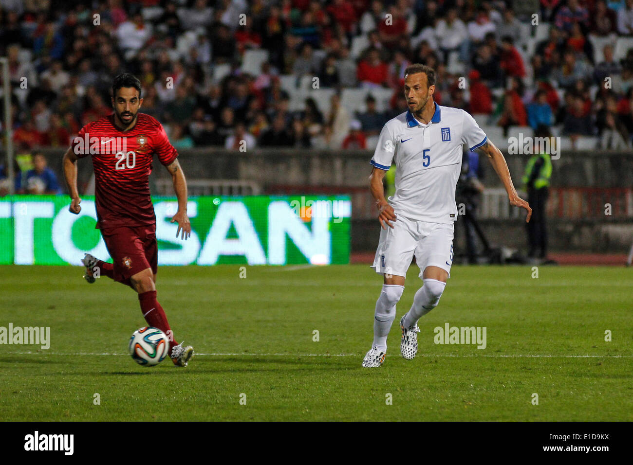 Lisbon, Porrtugal. 31st May, 2014. Portugal midfielder Ruben Amorin (20) (left), and Greece defender Vangelis Moras (5) (right) during preparatory friendly match for the World Cup at the National Stadium in Lisbon, Portugal, Saturday, May 31, 2014. Credit:  Leonardo Mota/Alamy Live News Stock Photo