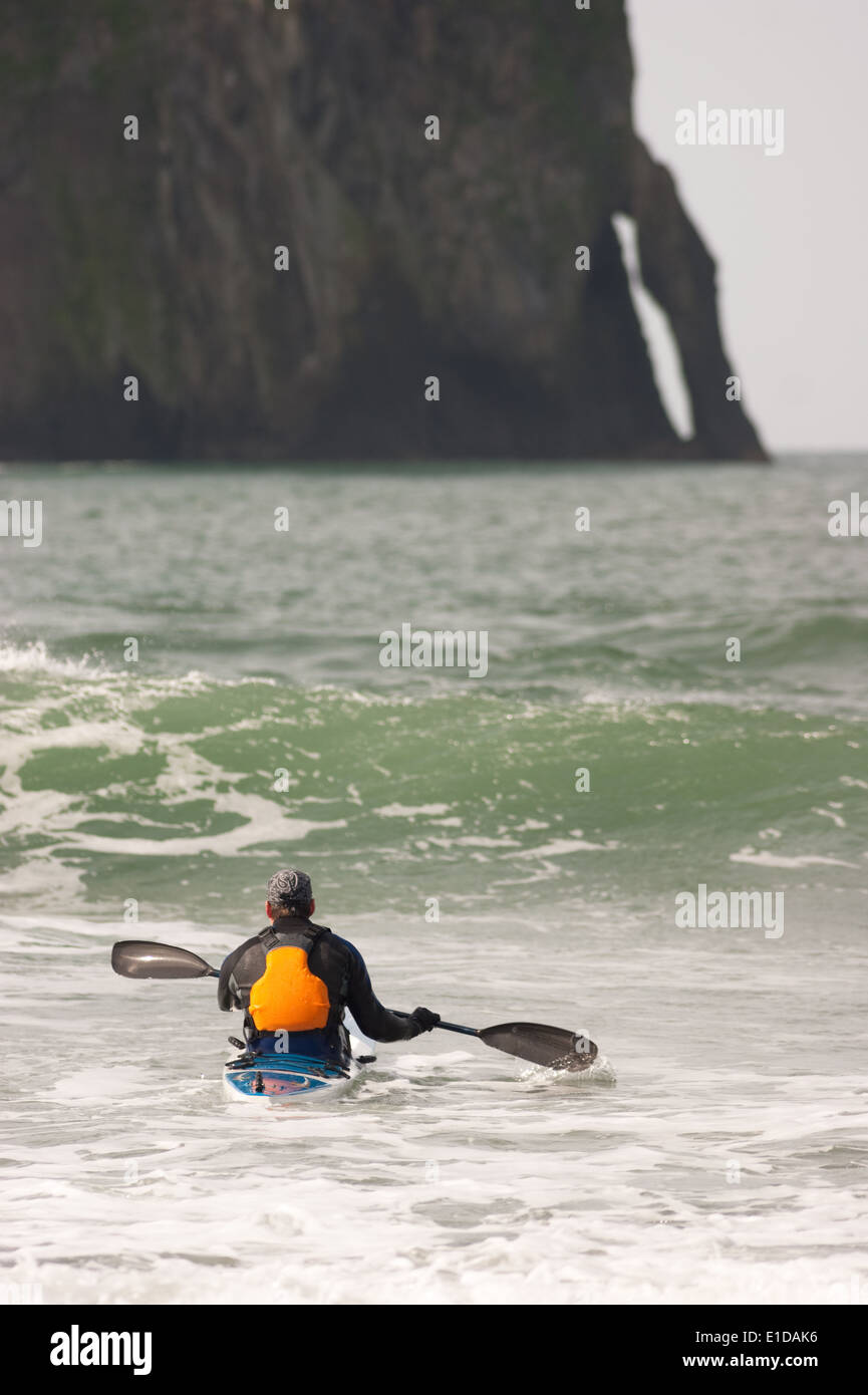 Vertical composition male kayaker trying to navagate a wave West Coast Stock Photo