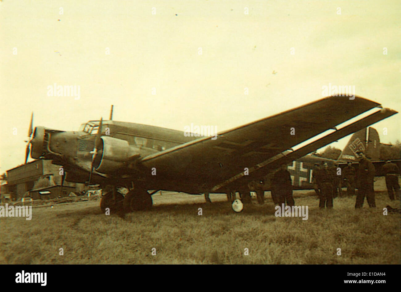 The Junkers Ju-52 was a trimotor aircraft used widely in the 1930s and 1940s by airlines and the Luftwaffe. Known as 'Auntie Ju' or 'Iron Annie,' it was recognized for its durability and versatility in both passenger and military service. Stock Photo