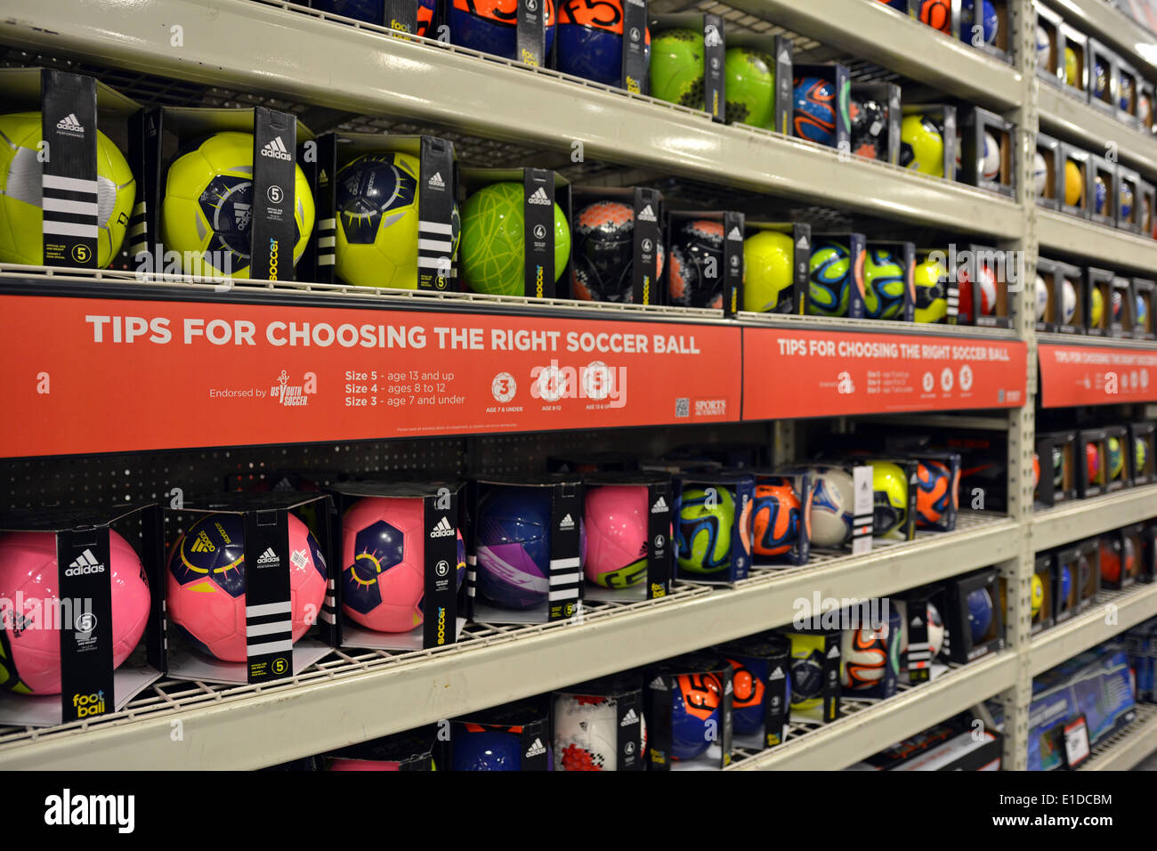 Soccer balls for sale at the Sports Authority store at the Cross Stock