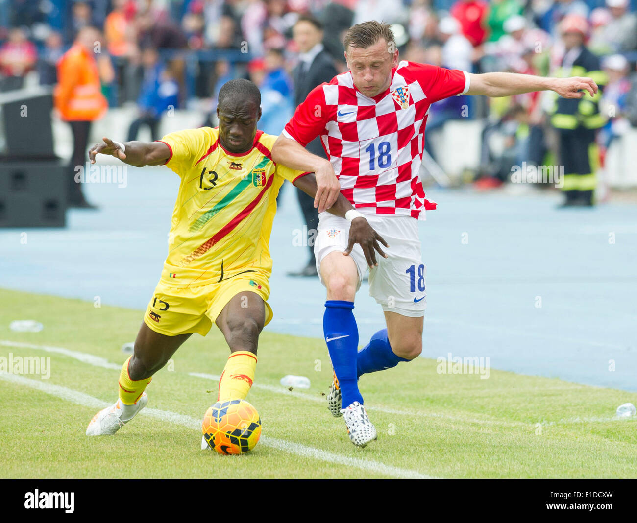 Osijek, Croatia. 31st May, 2014. Ivica Olic of Croatia (R) vies with Idrissa Coulibaly of Mali during the friendly match in Osijek, Croatia, May 31, 2014. Croatia won 2-1. Croatia will play Brazil in the opening game of the 2014 World Cup in Sao Paulo on June 12. Credit:  Miso Lisanin/Xinhua/Alamy Live News Stock Photo