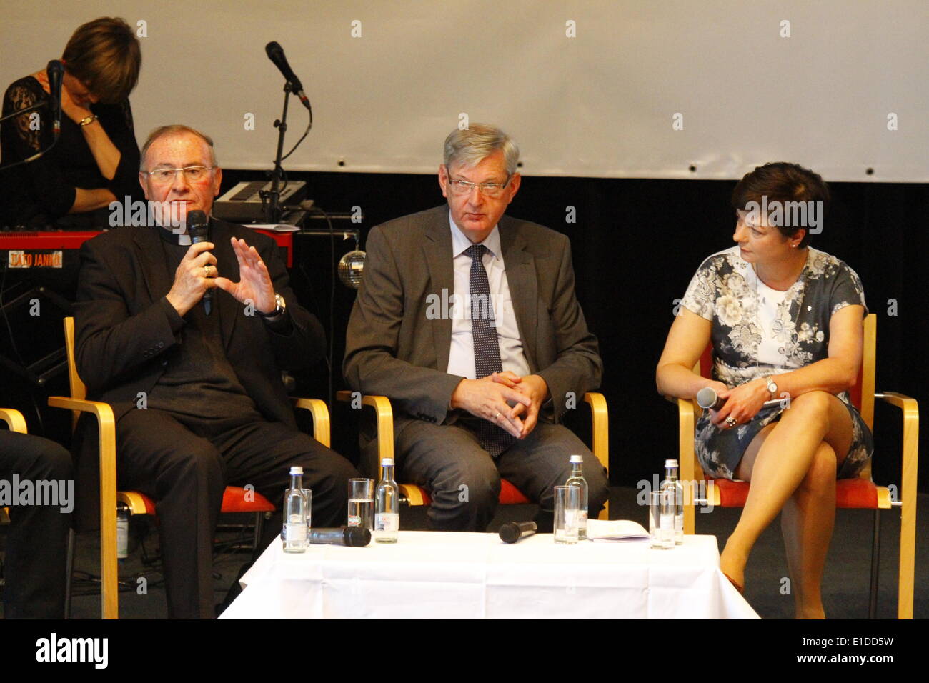 REGENSBURG, GERMANY- MAY 31: The Auxiliary bishop of Munich and Freising, Bernhard Ha§lberger (left), is pictured together with Regina Dolores Stieler-Hinz (right), the chairwoman of the Katholische Arbeitnehmer-Bewegung (Catholic Workers Movement) , at a panel discussion about Catholic associations at the 99th Deutscher Katholikentag (German Catholic Church Congress). The German Minister of the Interior Thomas de Maiziere visited the 99th Deutscher Katholikentag (German Catholic Church Congress) on day 2. He took part in a panel discussion about Catholic associations. (Photo by Michael Debets Stock Photo