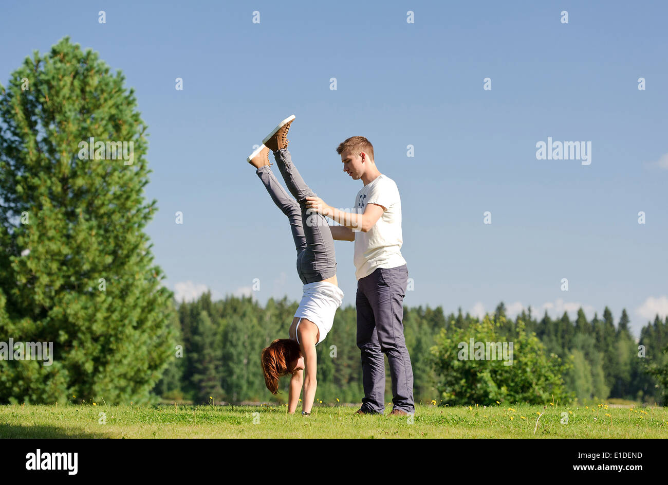 Handstand Outside Young woman doing handstand hi-res stock photography and images - Alamy