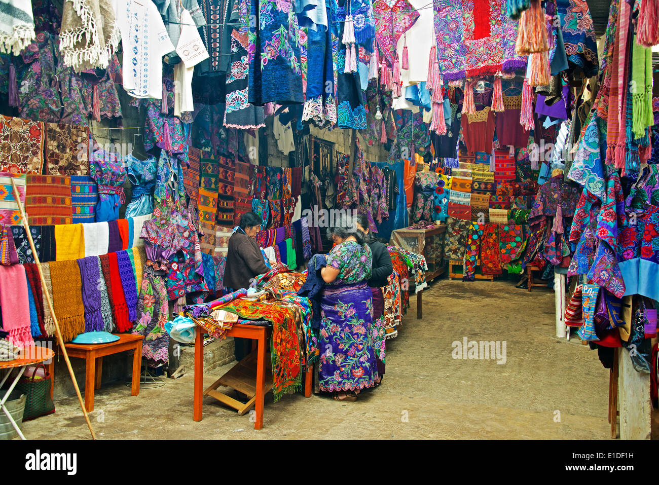 Interior textile and clothing shop San Lorenzo Zinacantan Village Chiapas Mexico Stock Photo