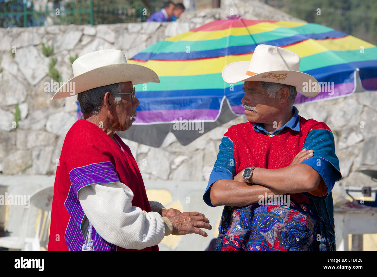 Two Tzotzil Indian men wearing traditional clothes Sunday market San Lorenzo Zinacantan Village Chiapas Mexico Stock Photo