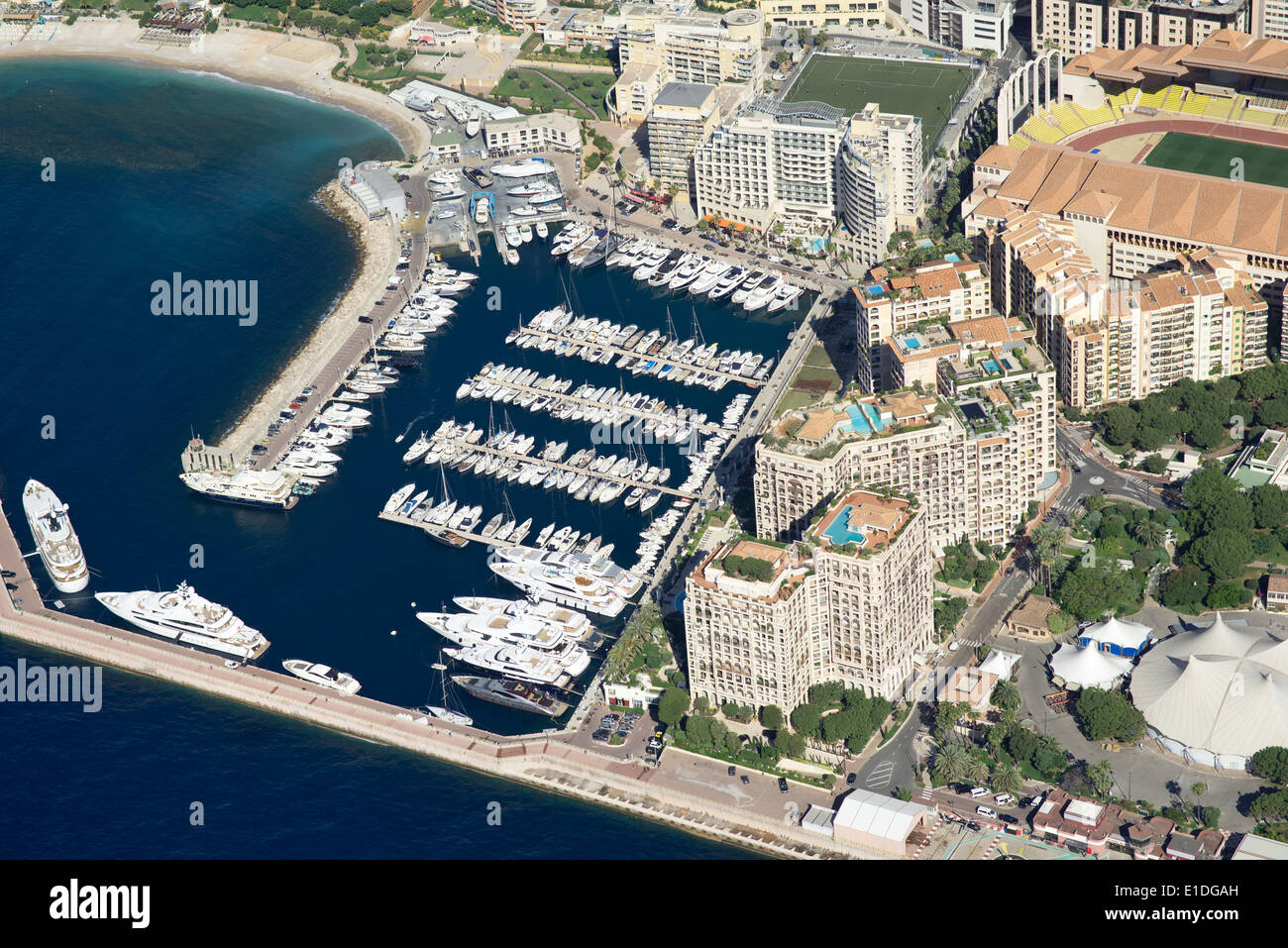 AERIAL VIEW. International border: Fontvieille housing development built on reclaimed land in Monaco and Cap d'Ail in France. Stock Photo