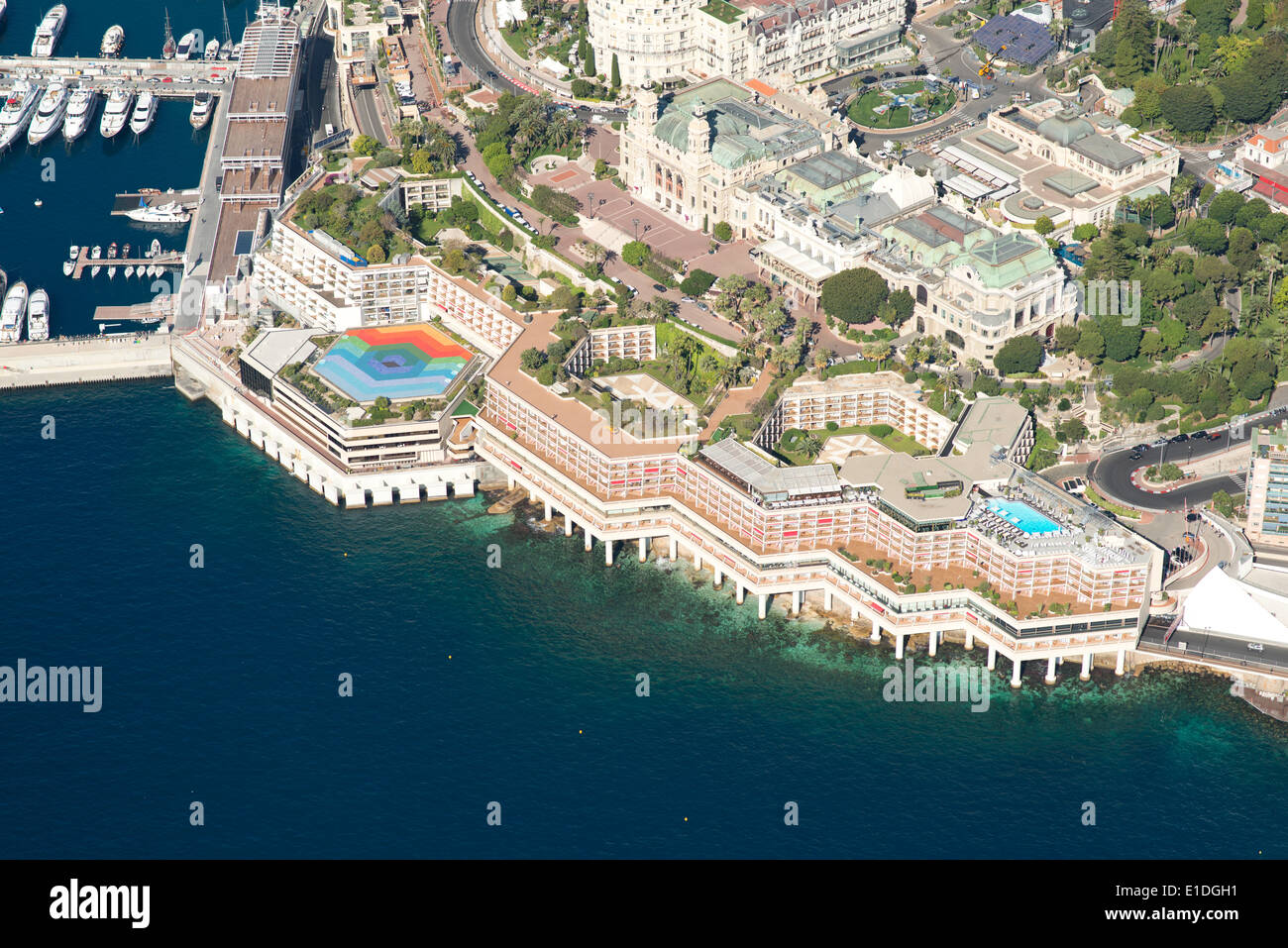 AERIAL VIEW. Fairmont Hotel on the seafront with the Monte-Carlo Casino standing behind. Ward of Monte-Carlo, Principality of Monaco. Stock Photo