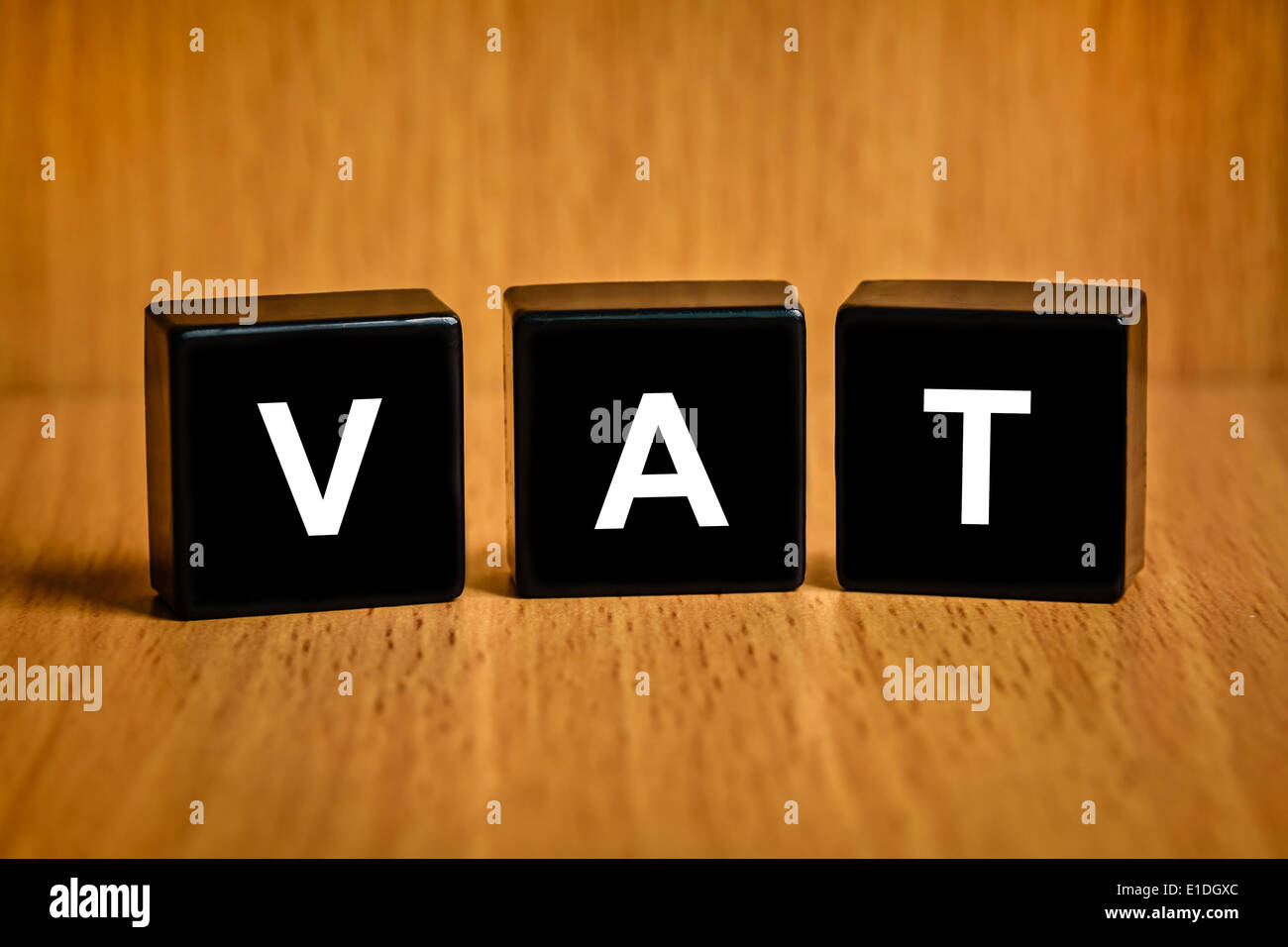 VAT or value added tax text on black block Stock Photo