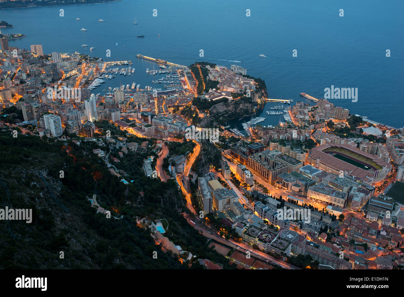 Twilight over the Principality of Monaco. Elevated view from an altitude of 550 meters above the Mediterranean Sea in La Turbie, France . Stock Photo