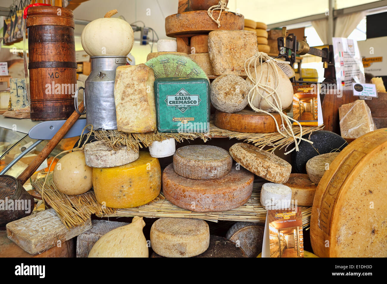 Different types of hard cheese on the market in Italy. Stock Photo