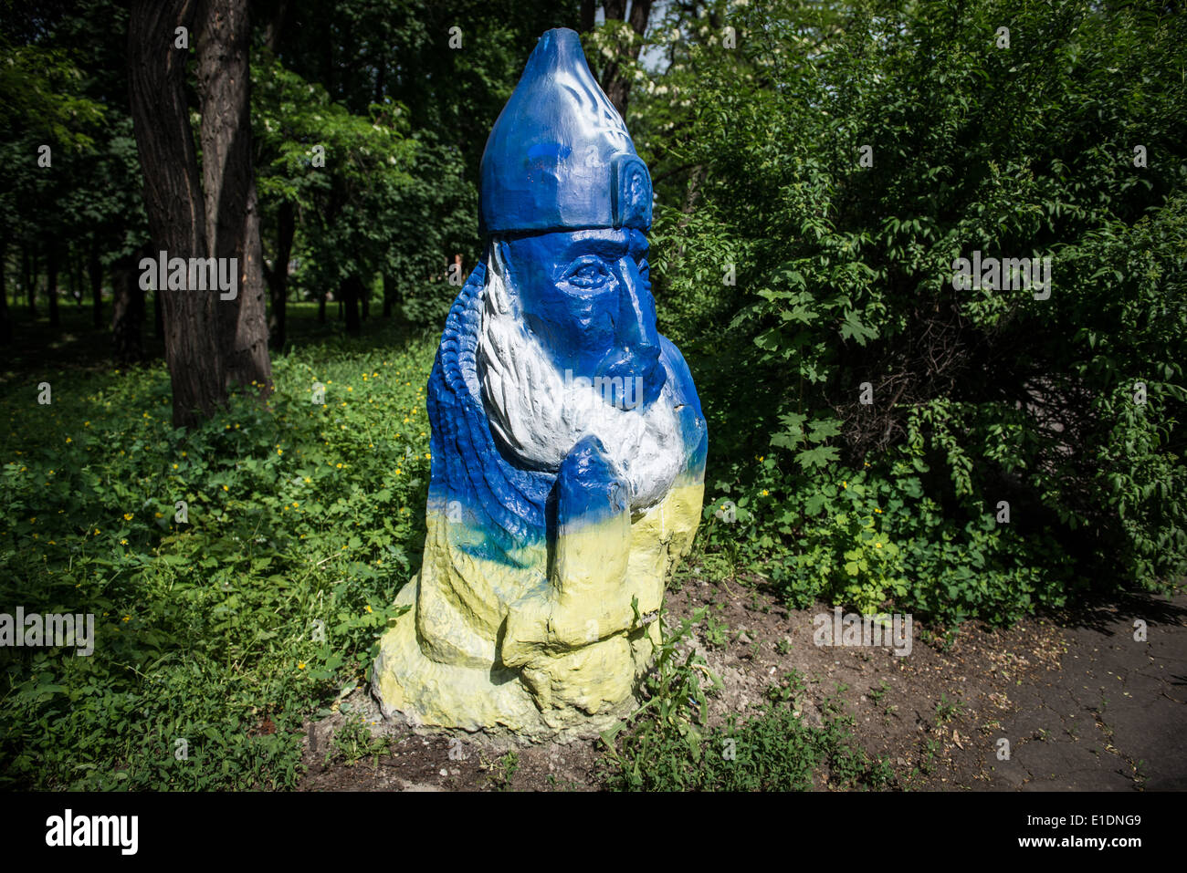 Slav figure in park painted in Ukrainian colors in Dobropillia, Donetsk Oblast during 2014 Pro-Russian conflict in Ukraine Stock Photo