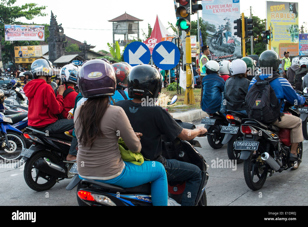 Motorcyclists in Bali at a traffic light Stock Photo