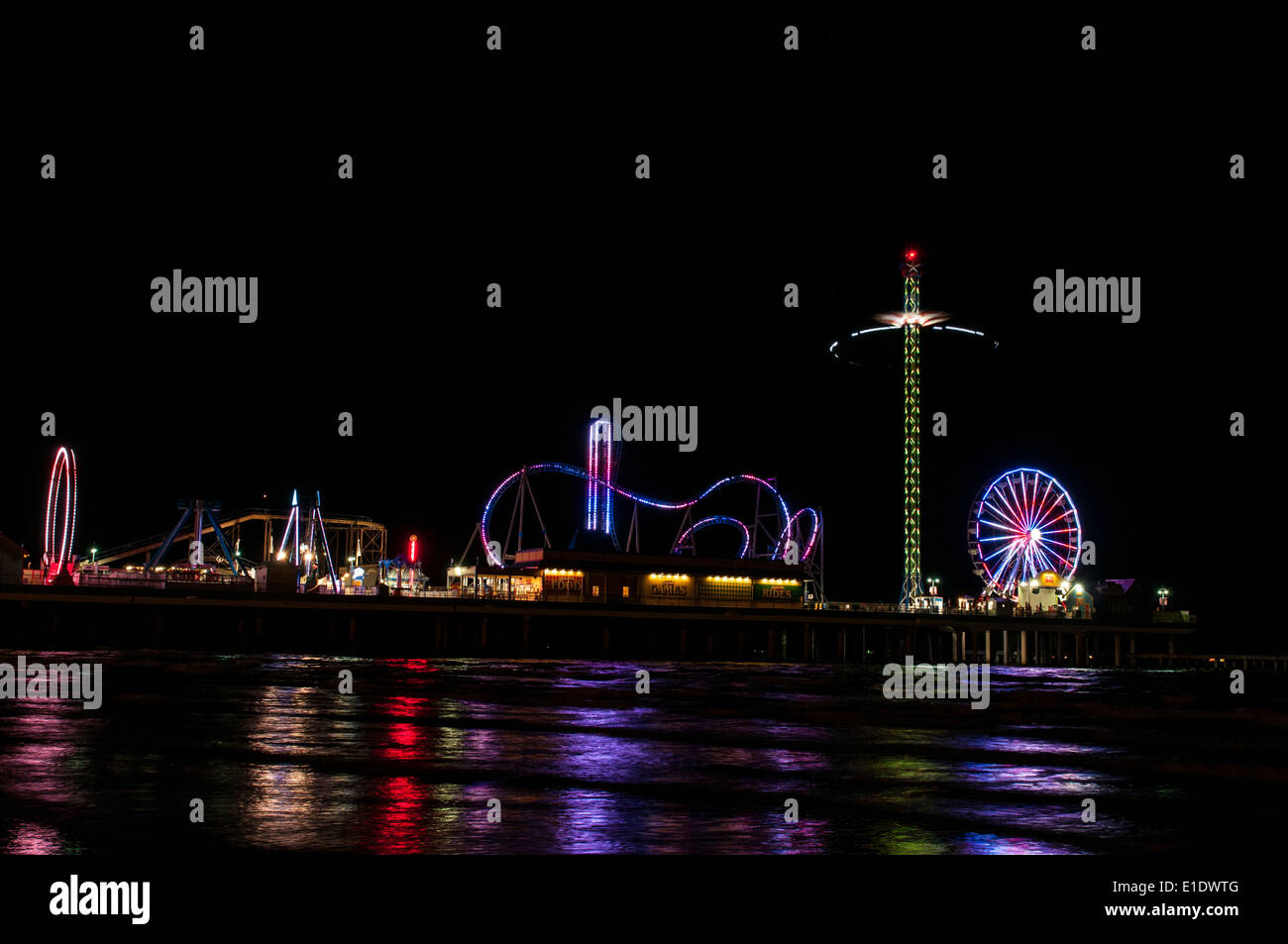 Night time at Pleasure Pier, a seaside amusement pier in Galveston, TX