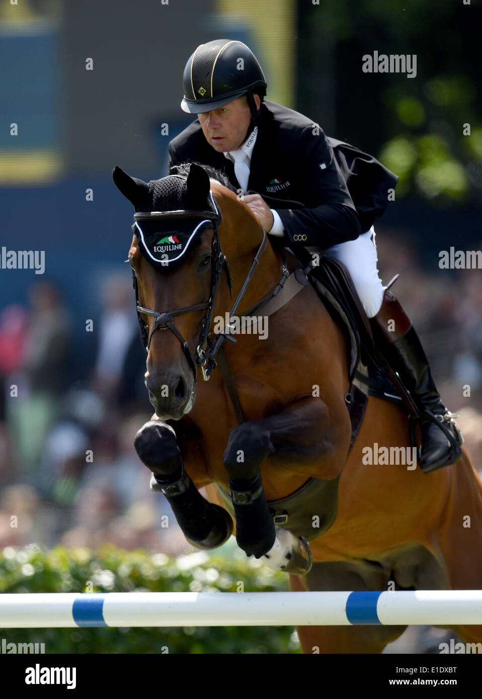 Hamburg, Germany. 31st May, 2014. Nick Skelton (Britain) on Big Star at the Great Prize of Hamburg as part of the 2014 Global Champions Tour in Hamburg, Germany, 31 May 2014. The German Show Jumping and Dressage Tournament takes place until 01 June. Photo: DANIEL REINHARDT/dpa/Alamy Live News Stock Photo