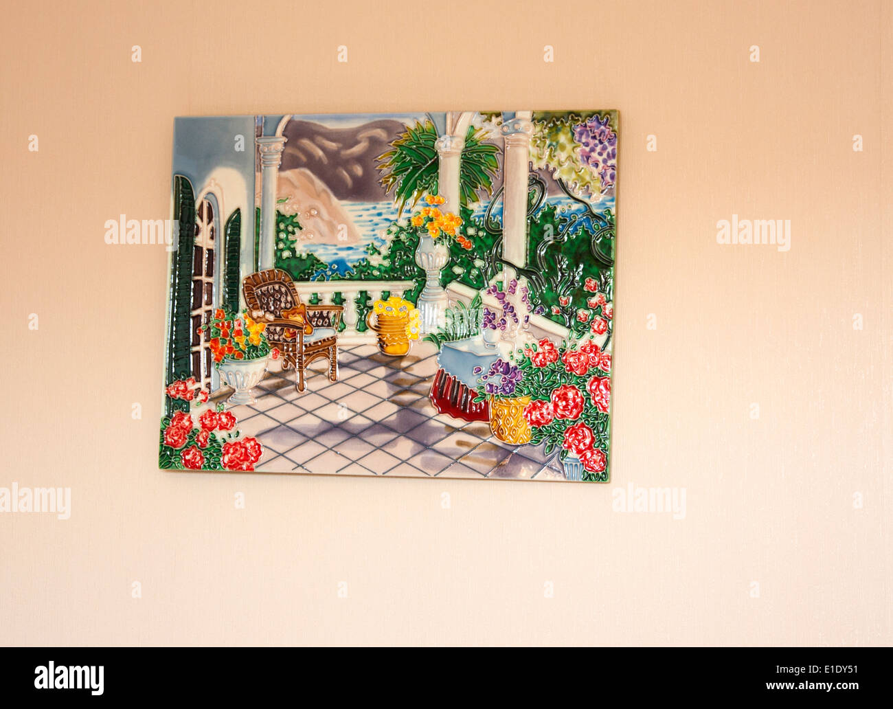 Painted tile hanging on a wall Stock Photo Alamy