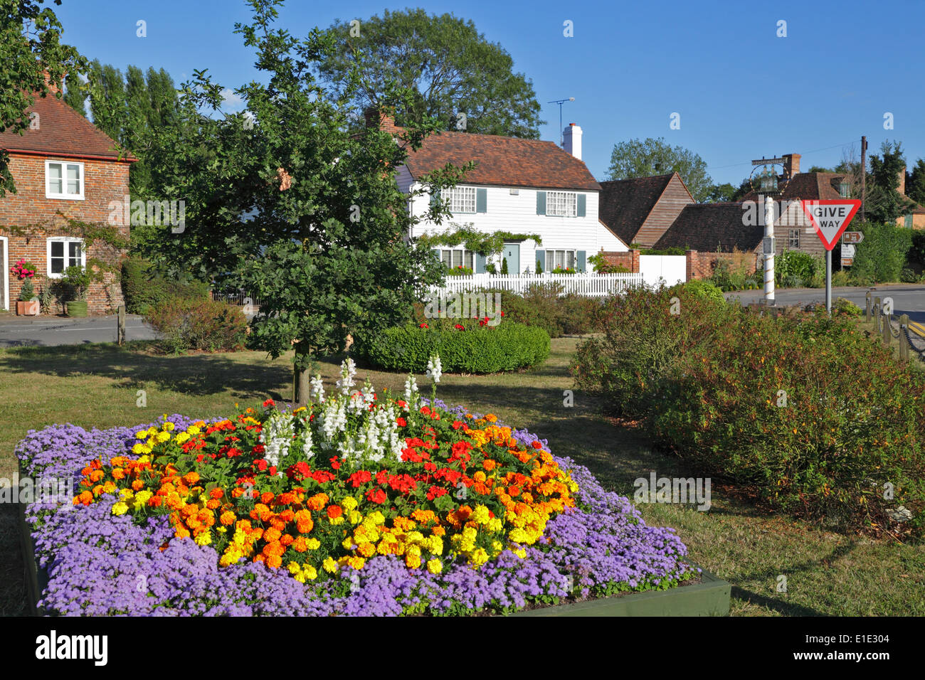 Flowers on Village green, Kent, England, UK Stock Photo