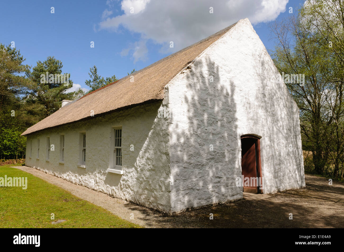 Traditional Irish school building, with whitewashed walls and thatched