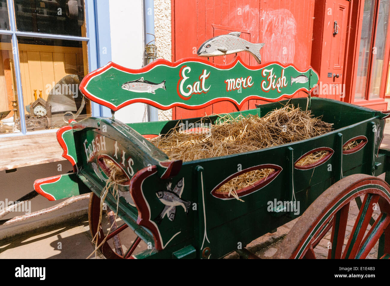 Old fashioned Irish fish cart with slogan Eat More Fish on a traditional  street Stock Photo - Alamy
