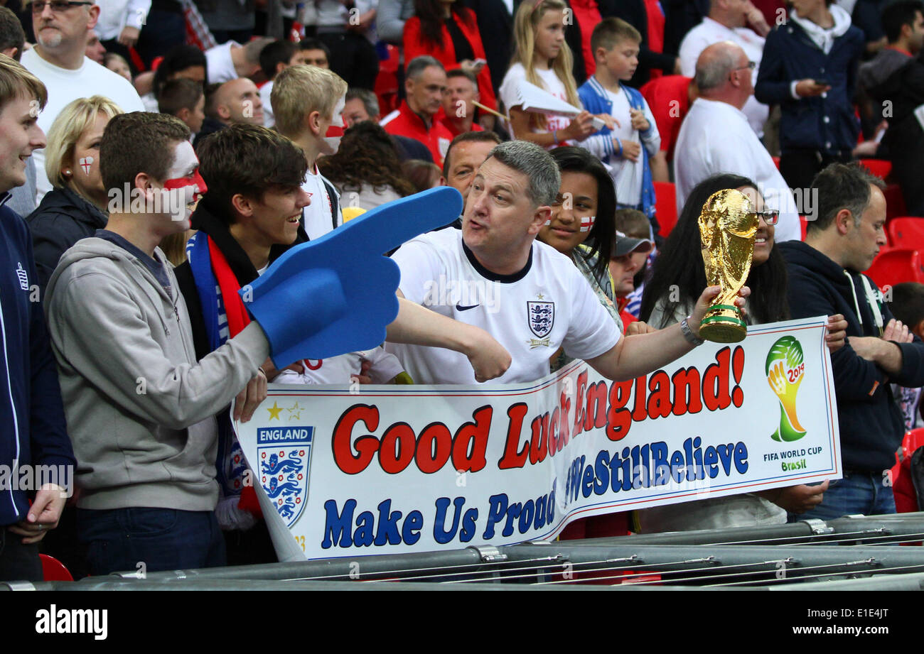 England v Peru - friendly . . London, UK . . 30.05.2014 An England fan holds up a replica World Cup as he wishes the team good luck. **This picture may only be used for editorial use only** Pic: Paul Marriott Photography Stock Photo