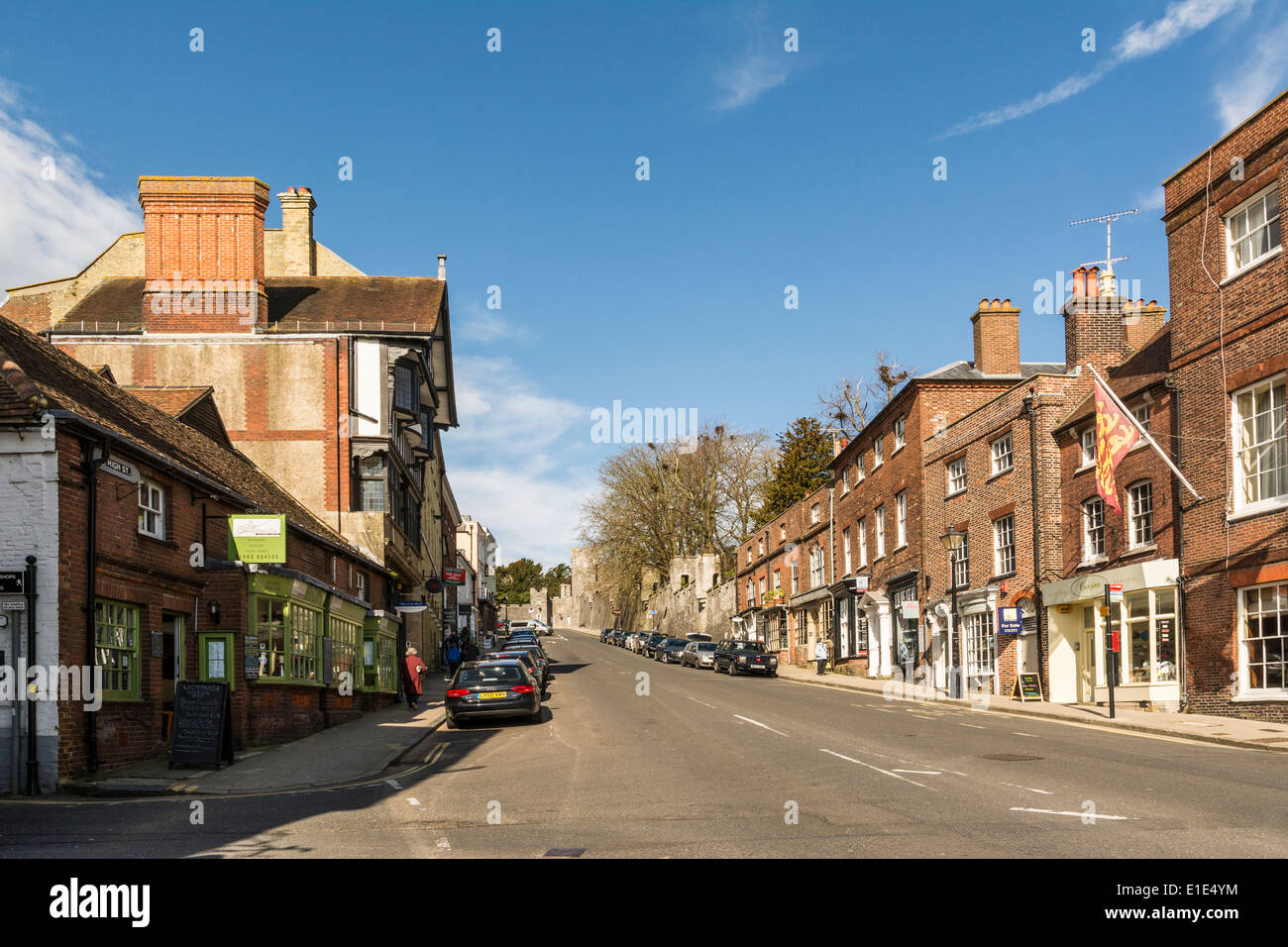 The Main High Street in Arundel leading up towards the castle, Arundel, West Sussex. Stock Photo