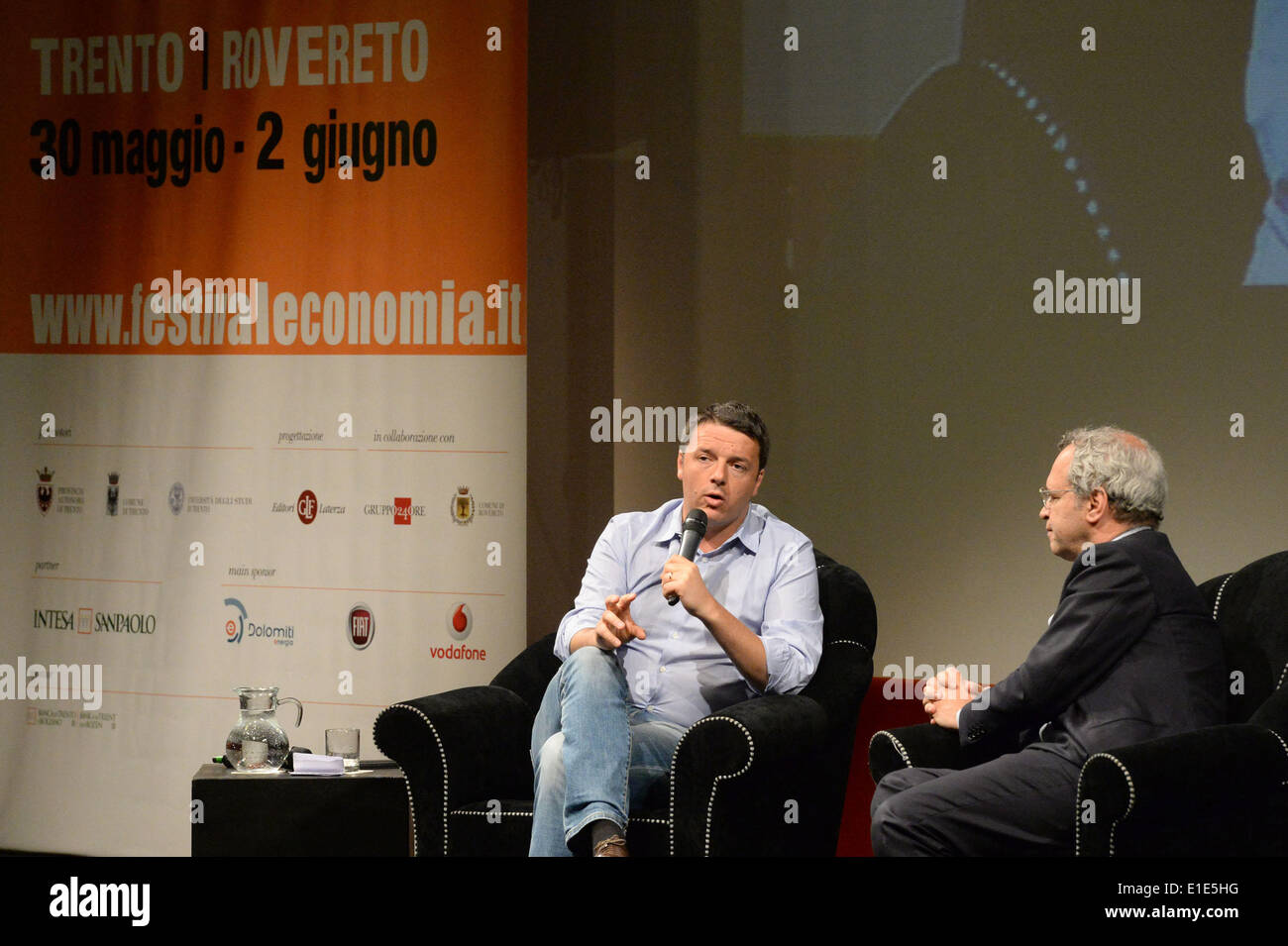 Trento. 1st June, 2014. Italian Prime Minister Matteo Renzi (L) attends the Trento Economics Festival in Trento, Italy, June 1, 2014. Renzi on Sunday pledged to make public administration in his country efficient and transparent, which he said is a fundamental condition for Italy to have a lead role in the construction of a stronger Europe. Credit:  Xinhua/Alamy Live News Stock Photo
