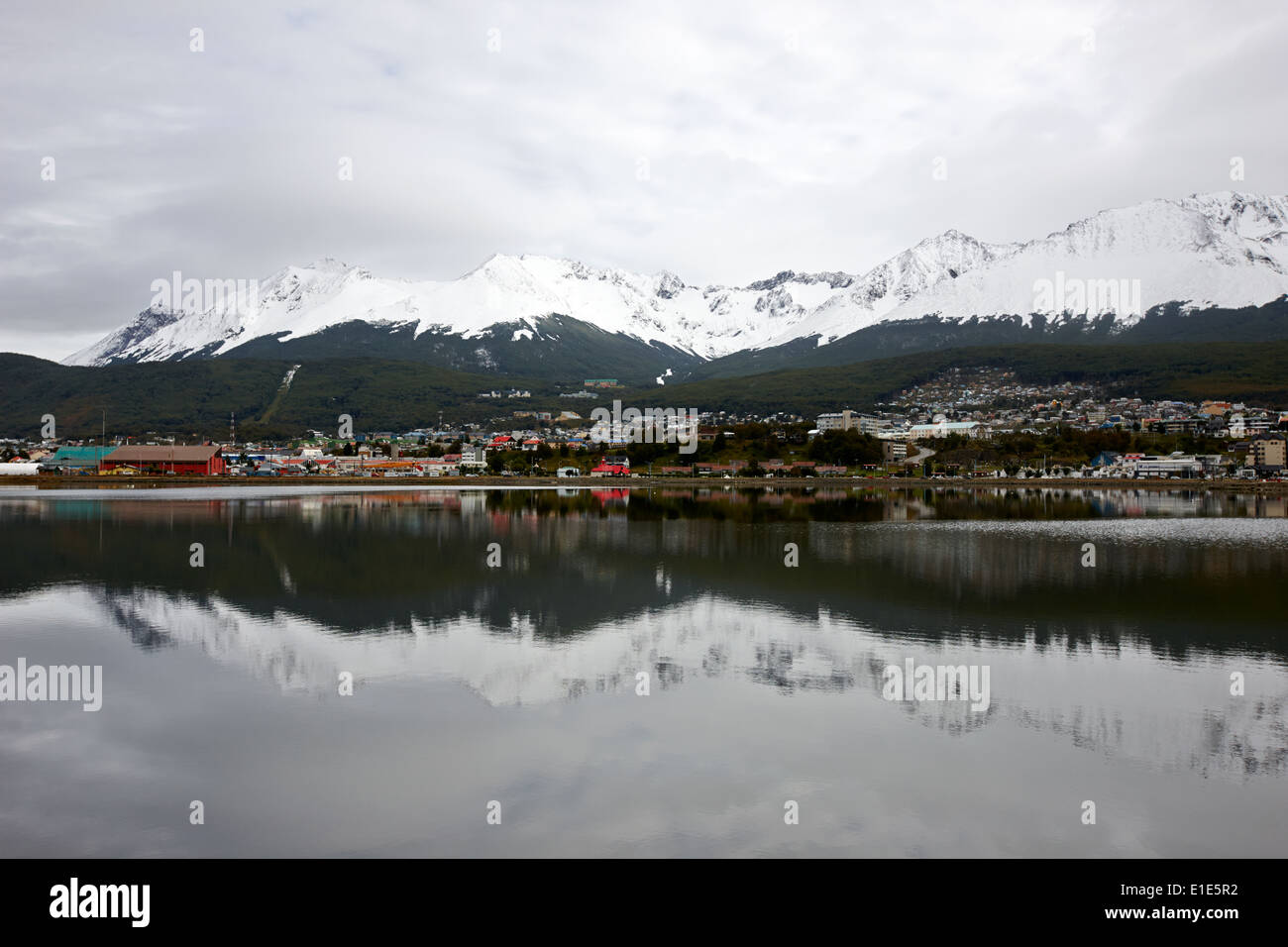snow covered patagonian mountains from across the bahia encerrada enclosed bay Ushuaia Argentina Stock Photo