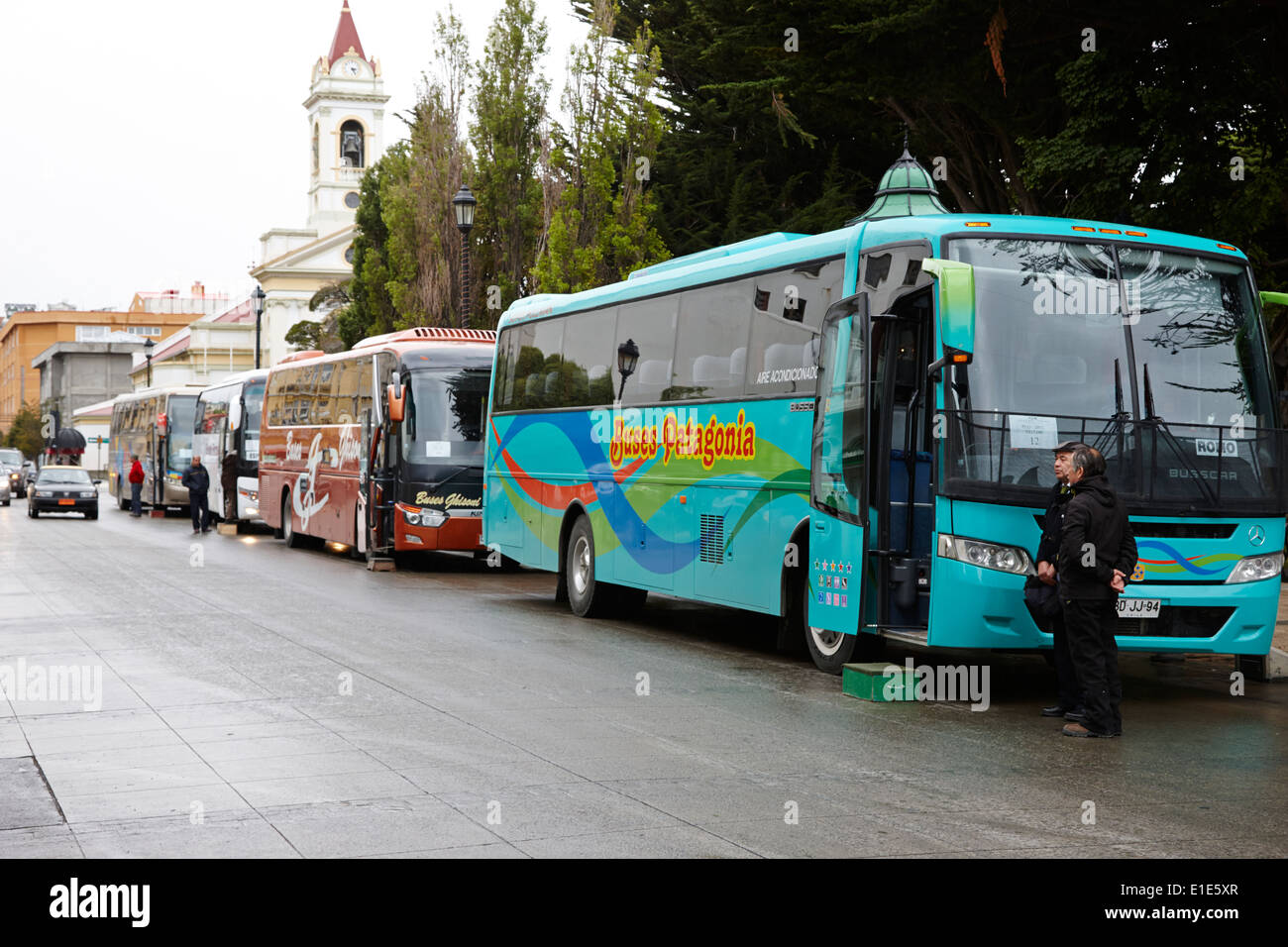 tour busses waiting for tourists in the main square Punta Arenas Chile Stock Photo