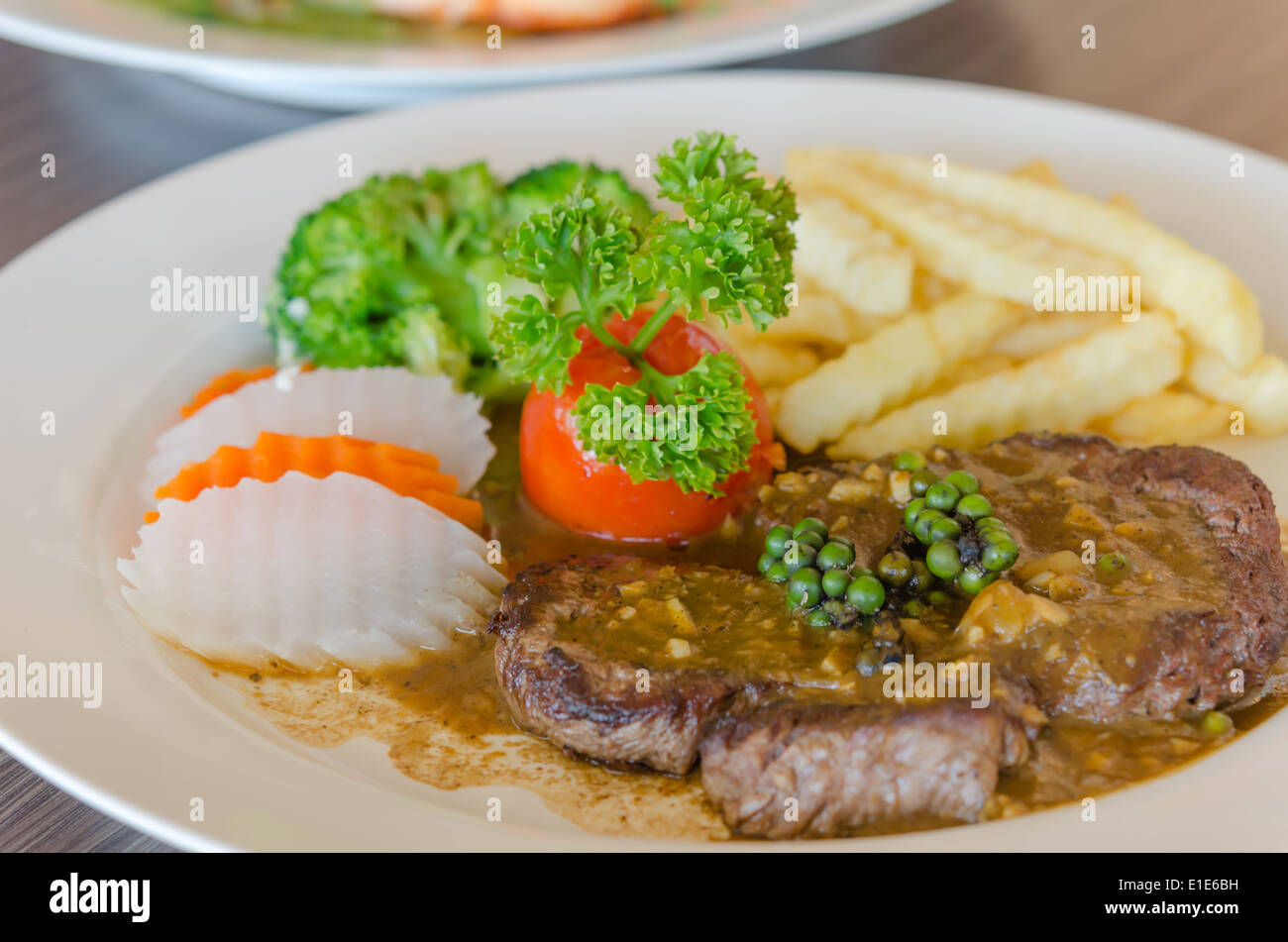 close up beef steak with green peppercorn sauce Stock Photo Alamy