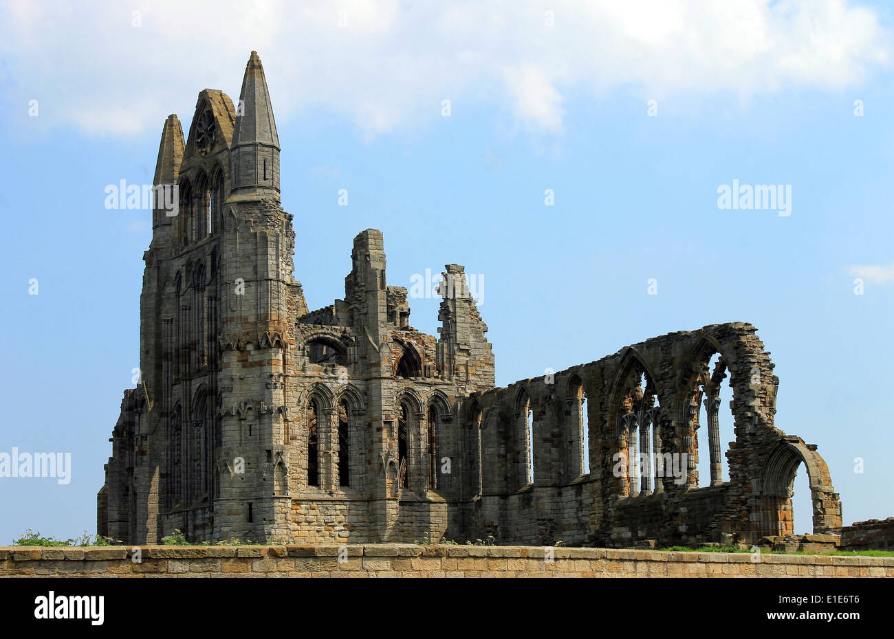 Scenic view of the ruins of Whitby Abbey with blue sky and cloudscape background. Stock Photo