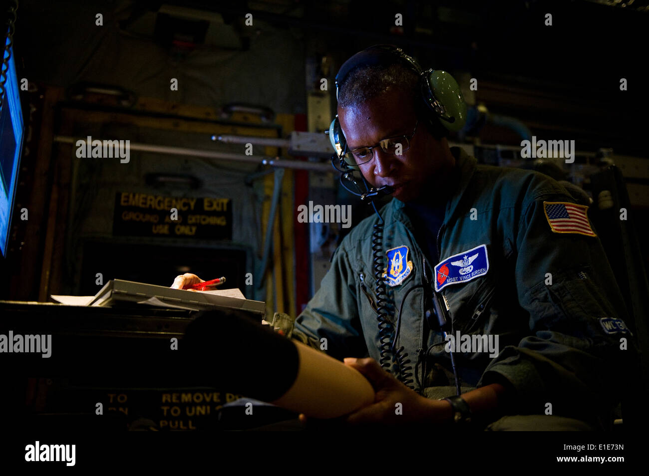 U.S. Air Force Master Sgt. Vince Burden, a loadmaster with the 53rd Weather Reconnaissance Squadron, Air Force Reserve Command Stock Photo