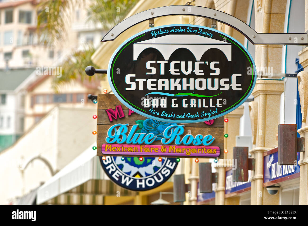Restaurant Signs Hanging Above Crescent Avenue In Avalon, Santa Catalina Island, California. Stock Photo