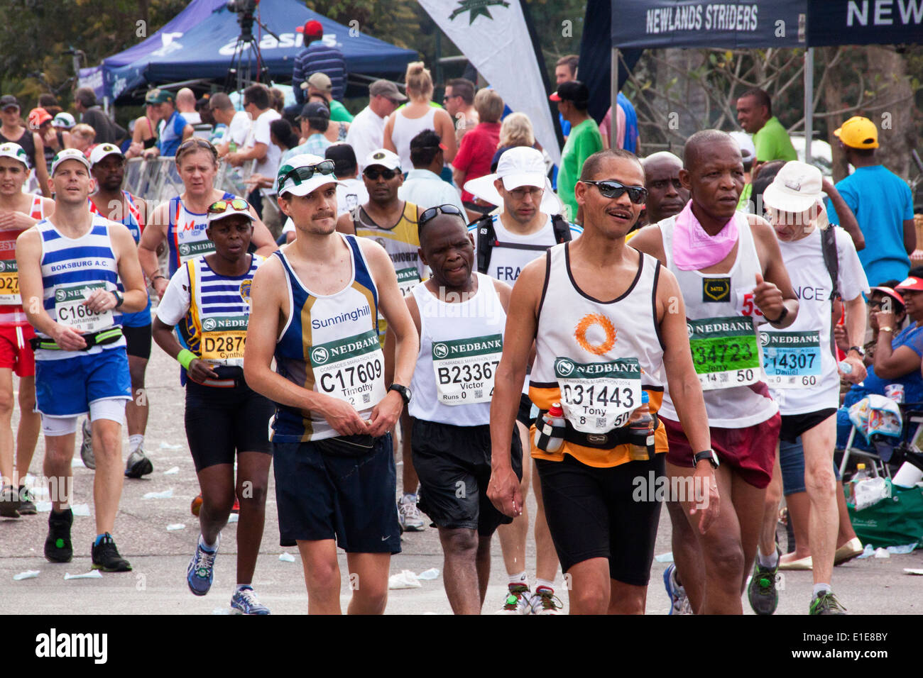 Spectators and Group of runners in the long distance Comrades Marathon