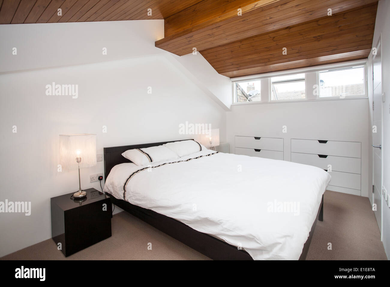 Converted Attic Bedroom In Modern Home London Uk Stock