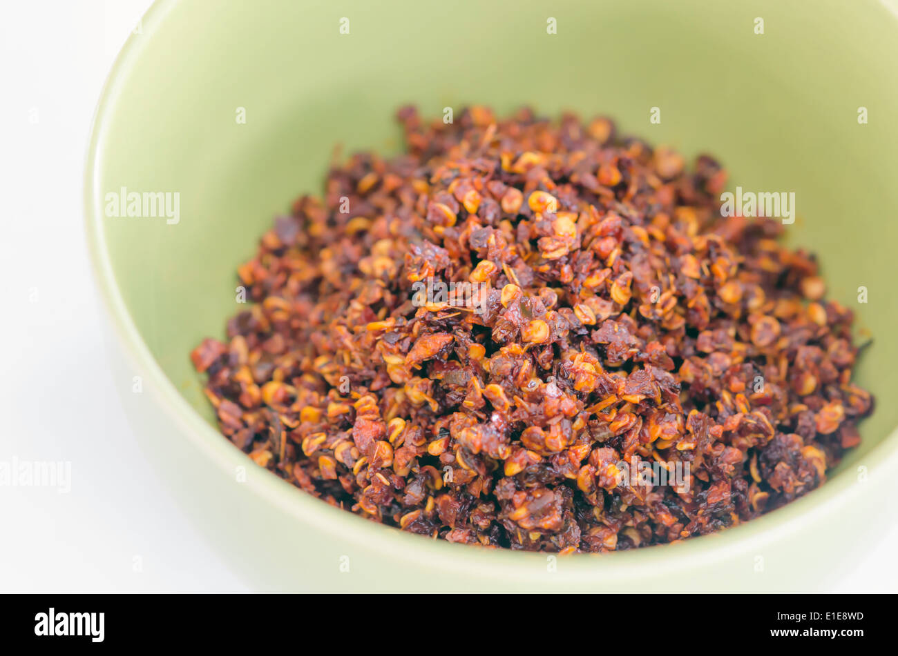 top view of crushed pepper pile , dried red chili flakes Stock Photo