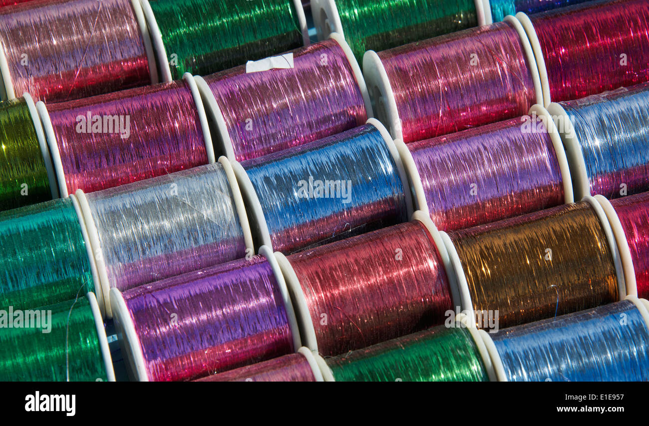 Colourful metallic thread for embroidery San Lorenzo Zinacantan Village Chiapas Mexico Stock Photo