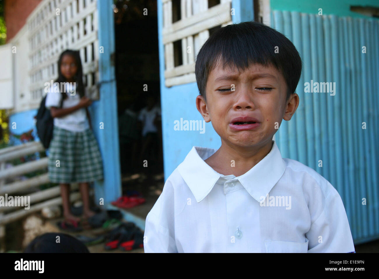 Rizal Province, Philippines. 2nd June, 2014. A student cries at a remote elementary school in Rizal Province, the Philippines, June 2, 2014. More than 23 million students returned to school on Monday for the first day of classes for the school year of 2014-2015. © Rouelle Umali/Xinhua/Alamy Live News Stock Photo