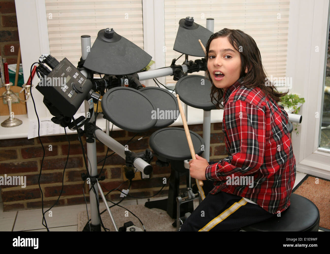 child playing drums Stock Photo